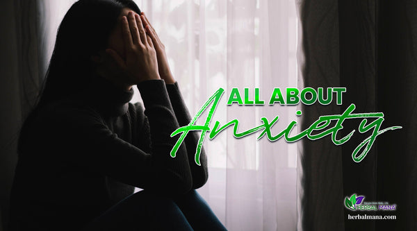 All About Anxiety woman sitting holding her face in dimly lit room green text overlay