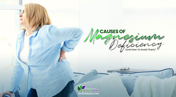 Causes of Magnesium Deficiency and How To Avoid Them woman in blue shirt holding back in pain looking out window