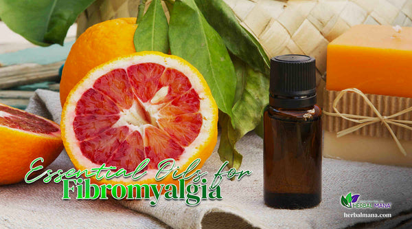 Essential Oils for Fibro orange cut in half next to amber glass essential oil bottle with decorative candle in background