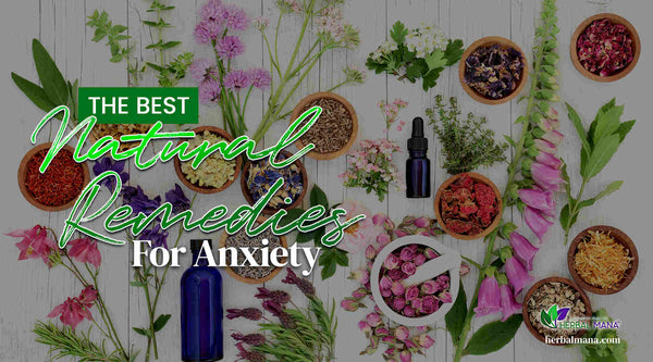 The Best Natural Remedies For Anxiety blue glass essential oil bottles herbs and flowers in wooden bowls sitting on white table