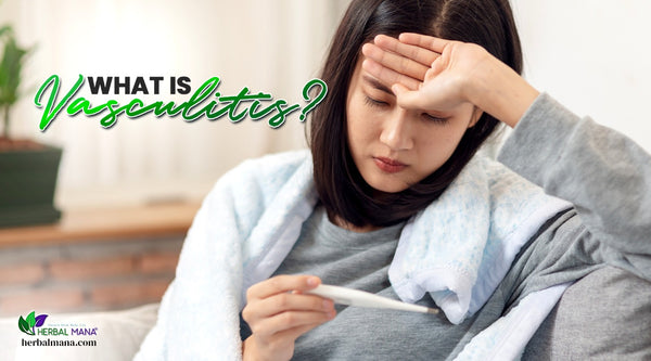what is vasculitis causes symptoms of vasculitis what natural treatment for vasculitis may help woman wearing gray sweatshirt sitting on couch with hand to head taking her temperature due to fever light background