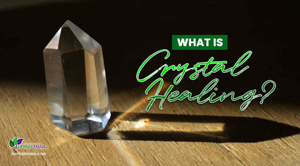 what is crystal healing quartz point giving off rainbow on wood table black background green text overlay